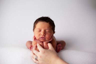 newborn safety 4 things to consider when choosing a newborn photographer hands