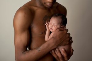 Dad soothing crying baby  in Huntington Beach California 