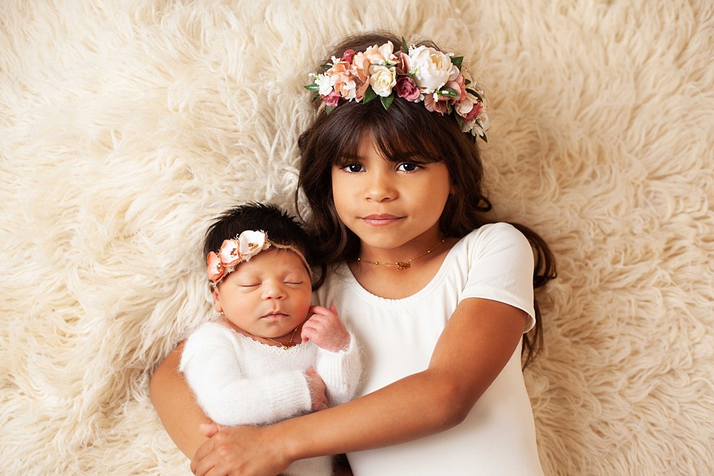 Newborn with sibling on Flokati blankets create stunning, gorgeous portraits. 