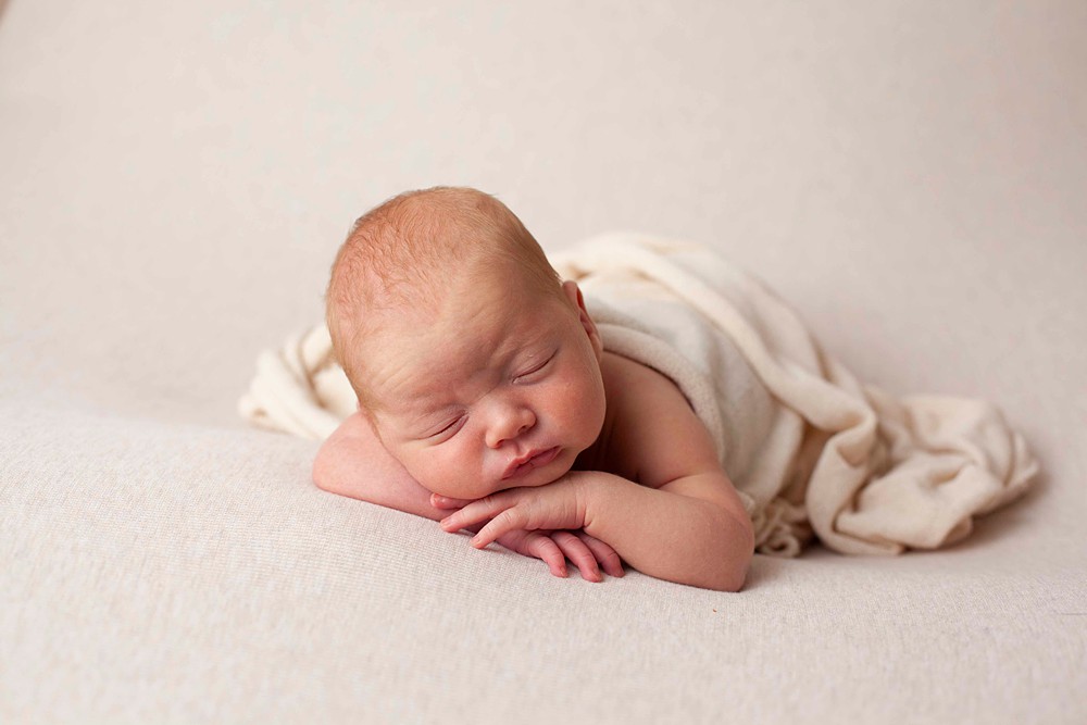 Wraps and blankets are simple and elegant in creating stunning newborn portraits.