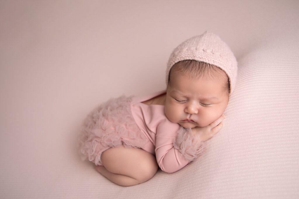 Newborn baby girl names Mary posed in bum up pose for newborn photographers 