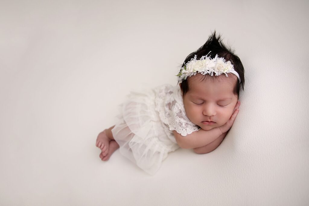 Newborn Girl in white backdrop in Westminster California Studio 