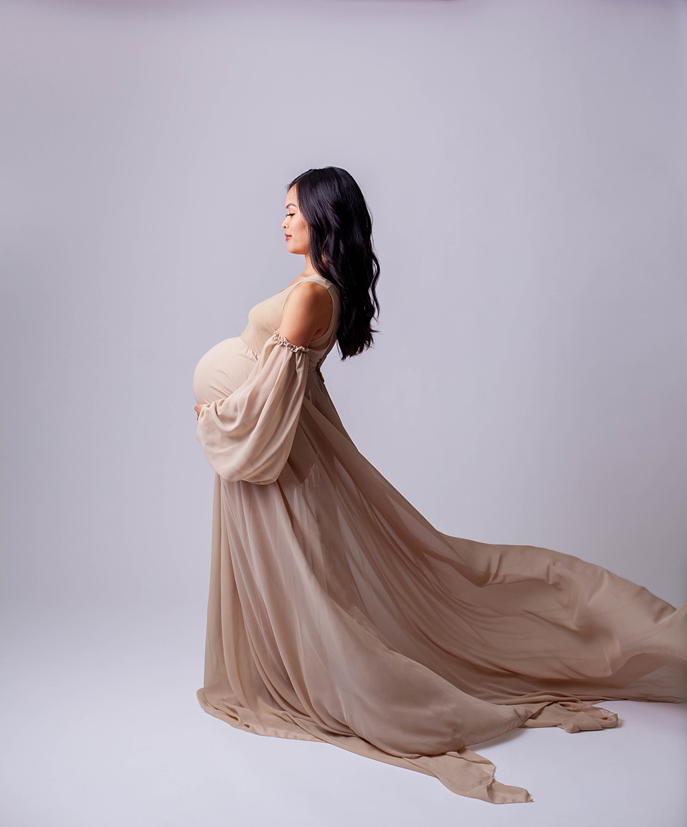 Maternity image with dress and white background