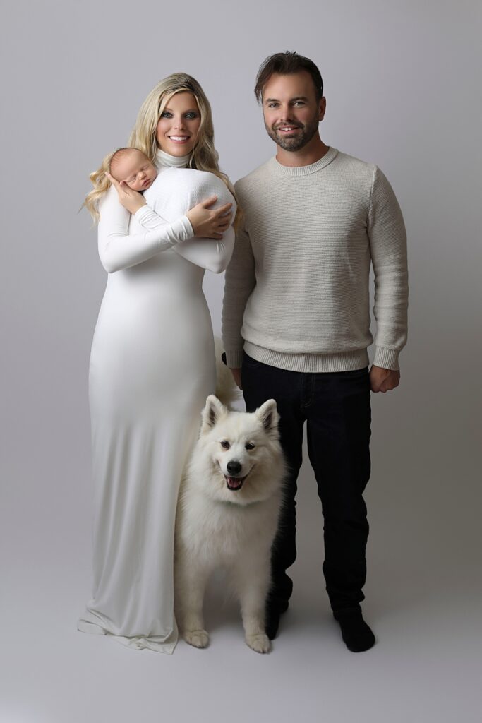 Newborn family with dog by a Westminster Family Photographer