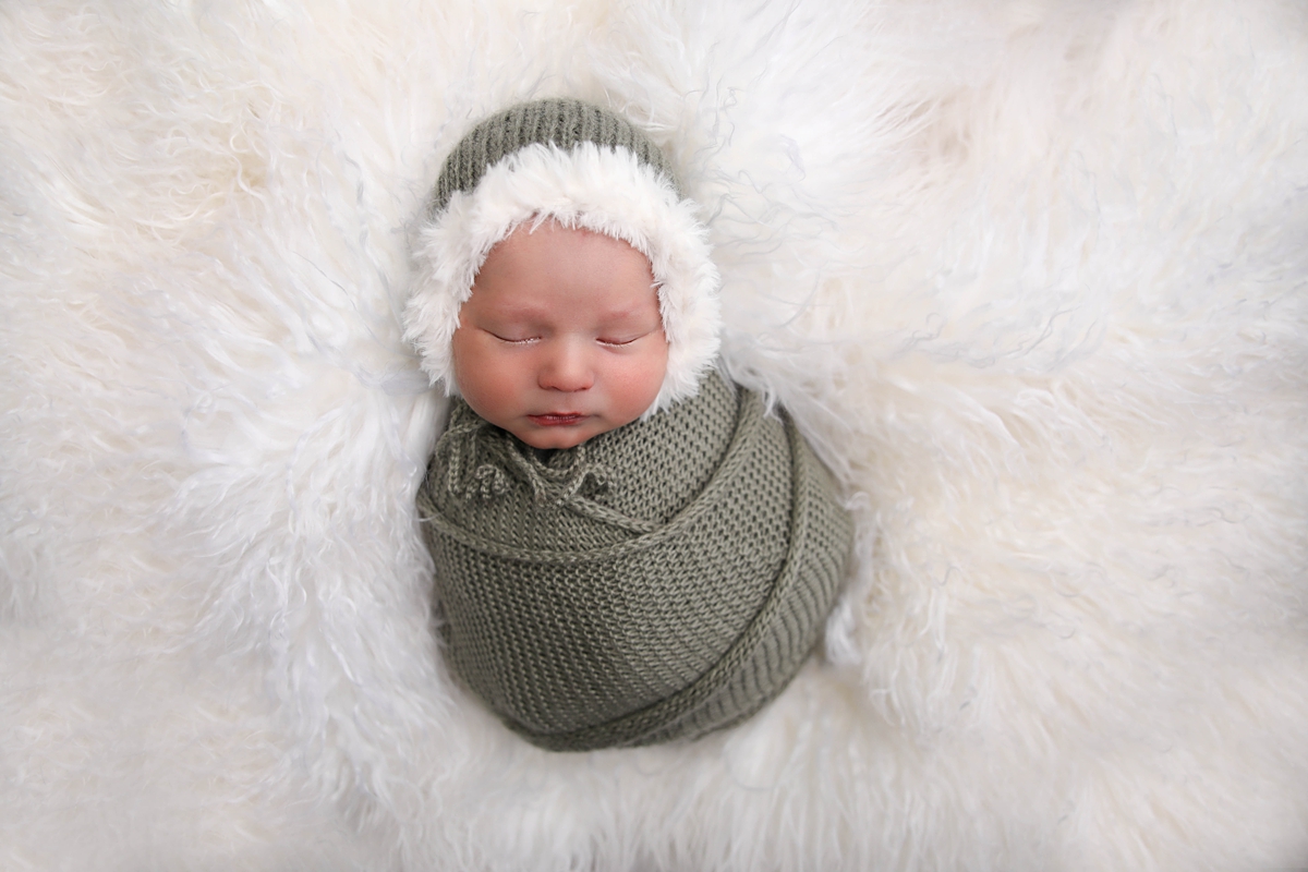 newborn boy swaddled in a Anaheim Newborn Photographer Studio