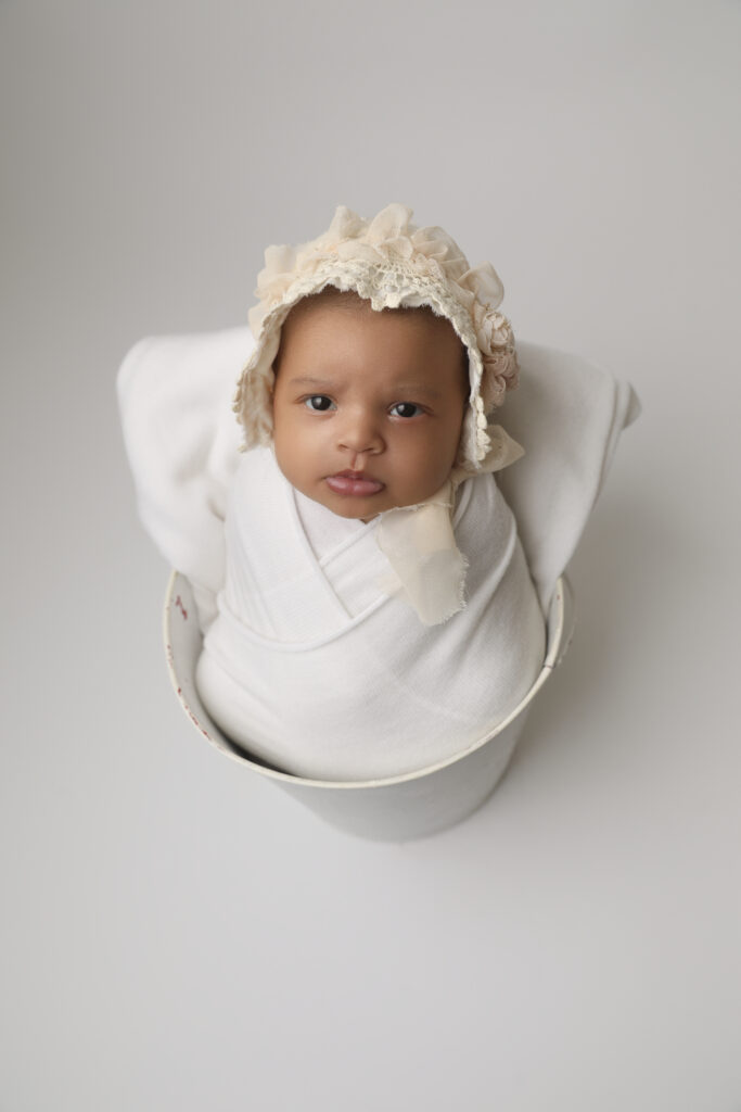 Newborn girl with bonnet from a Buena Park Newborn Photographer