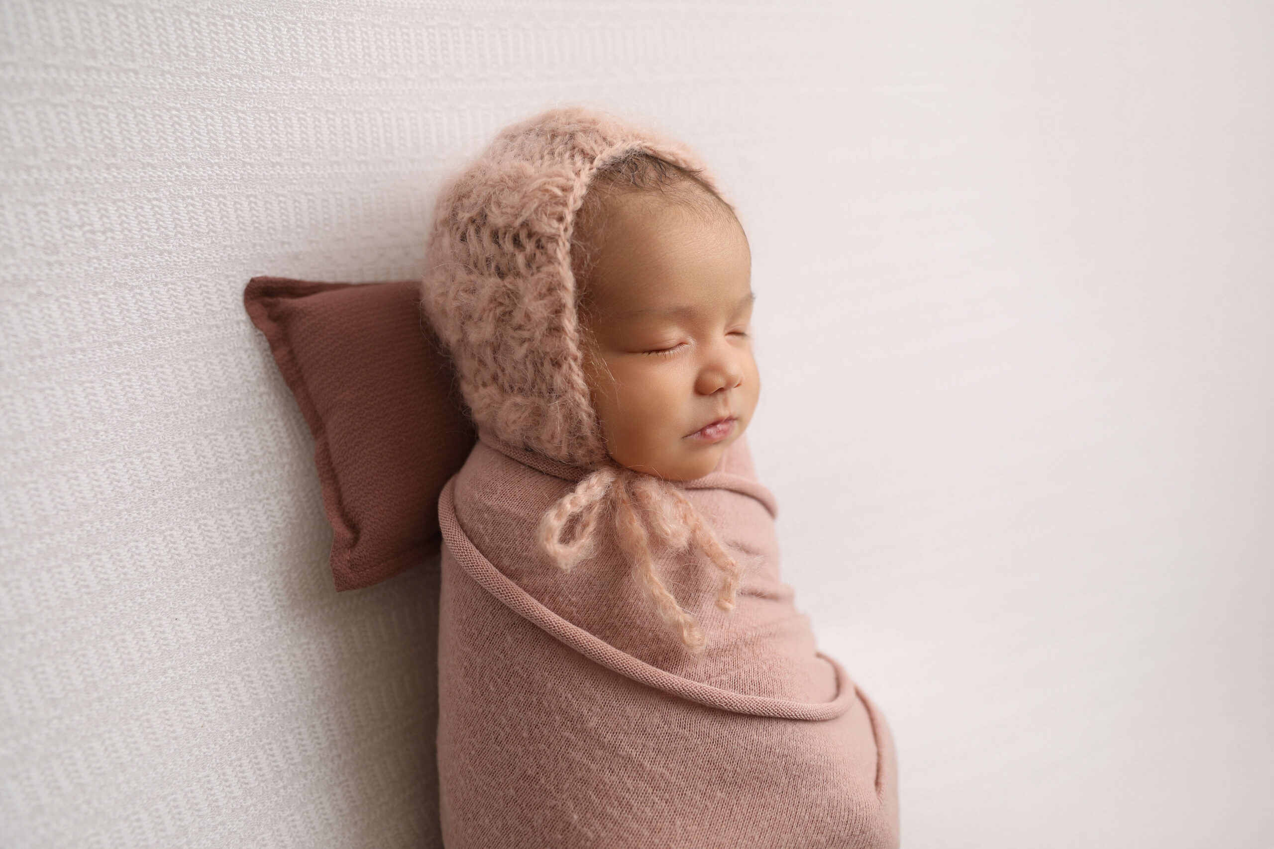 Newborn Girl Wrapped up by a Huntington Beach Photographer