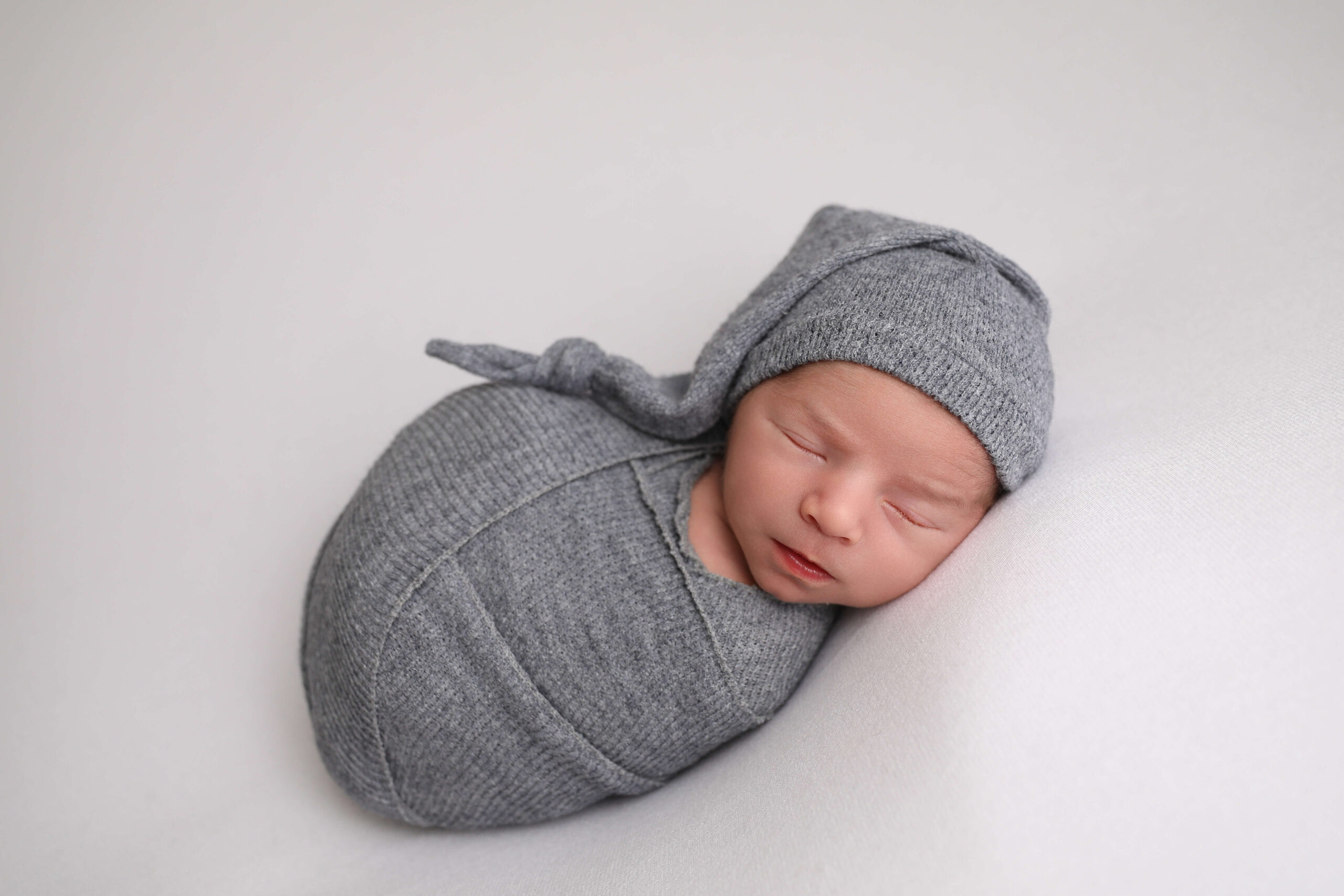 Newborn Boy Swaddled in Lake Forest by a Newborn Photographer