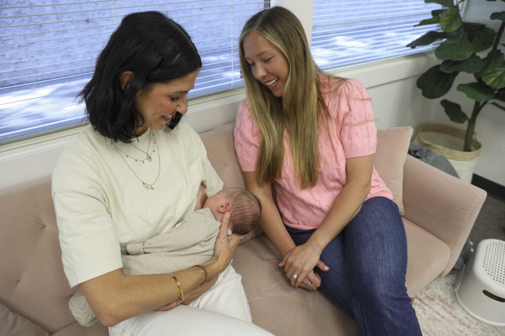 Lactation Consultant checking breastfeeding position. 